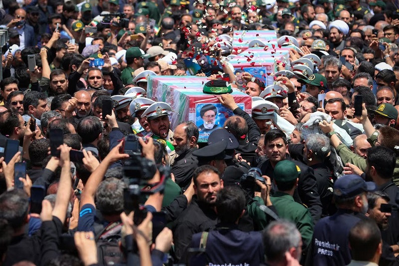 mourners carry the coffin of late iranian president ebrahim raisi during his burial ceremony in mashhad iran may 23 2024 photo reuters