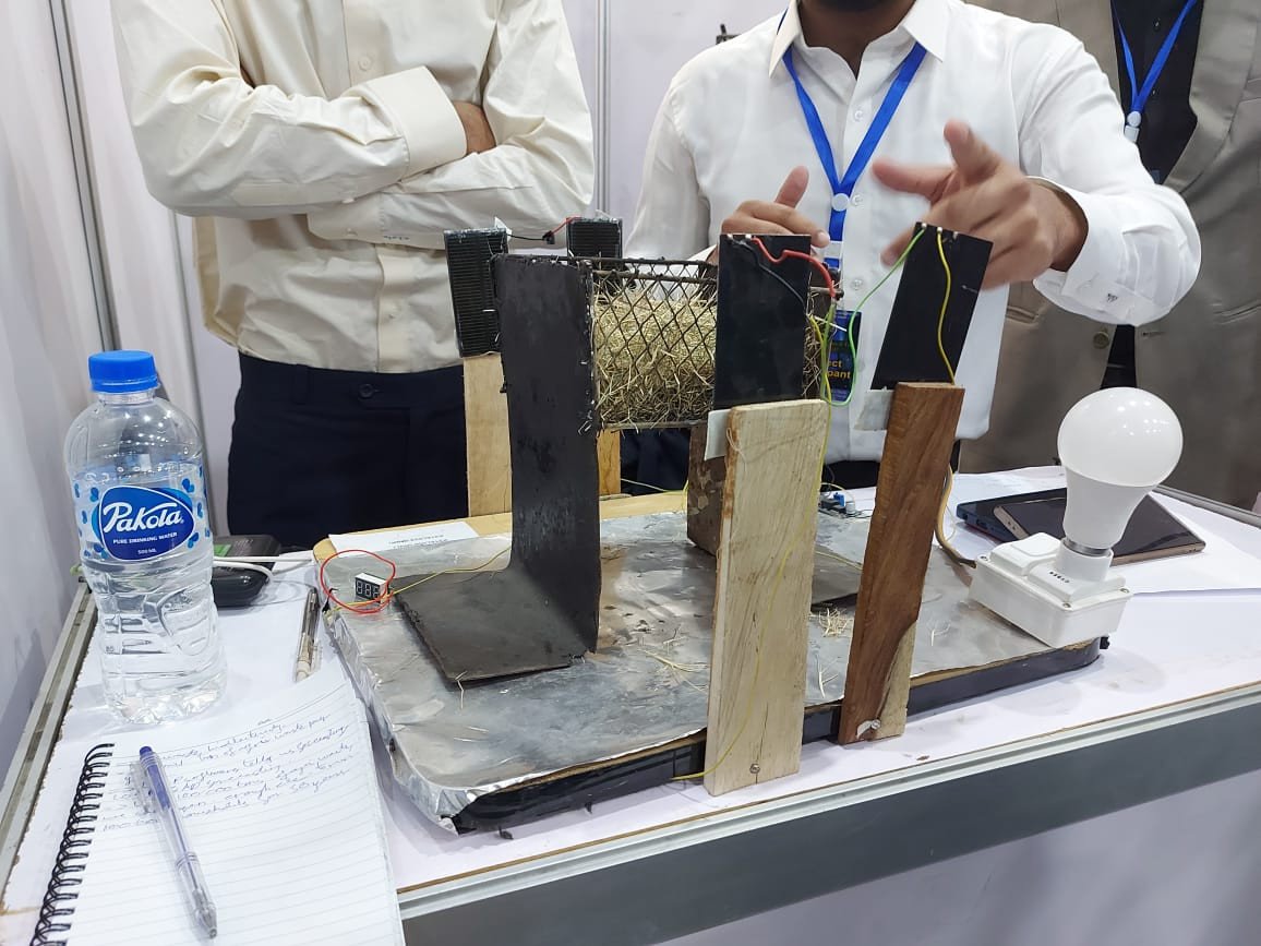 The model with biowaste in the basket is connected to a lightbulb and PVT cells