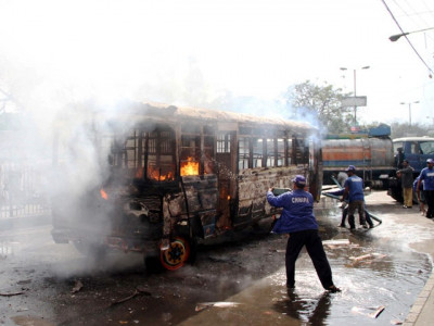 mob torches bus for running over three friends