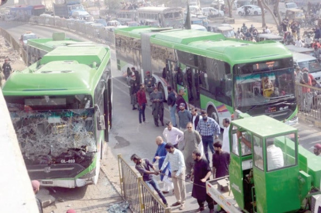 repair crew move a green line bus from the track near nagan chowrangi in north naziamabad after an accident on friday photo nni