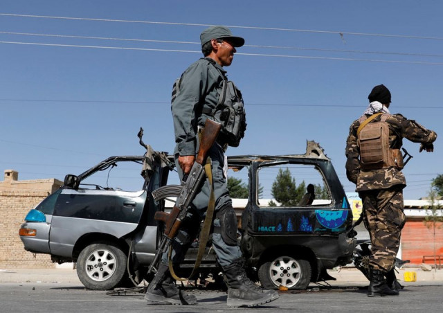 afghan police officer inspects a damaged van after a blast in kabul afghanistan june 3 2021 photos reuters afghan police officer inspects a damaged van after a blast in kabul afghanistan june 3 2021 photos reuters