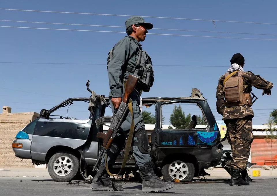 afghan police officer inspects a damaged van after a blast in kabul afghanistan june 3 2021 photos reuters afghan police officer inspects a damaged van after a blast in kabul afghanistan june 3 2021 photos reuters