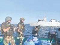pakistan navy sailors search a suspicious drug laden dhow in the arabian sea photo inp