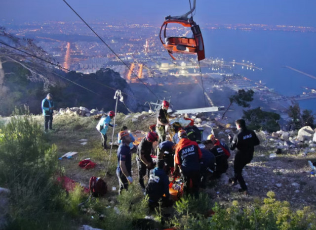 members of turkey s disaster management authority afad take part in a rescue operation after a cable car cabin collided with a broken pole in antalya turkey april 12 2024 ihlas news agency via photo reuters members of turkey s disaster management authority afad take part in a rescue operation after a cable car cabin collided with a broken pole in antalya turkey april 12 2024 ihlas news agency via photo reuters