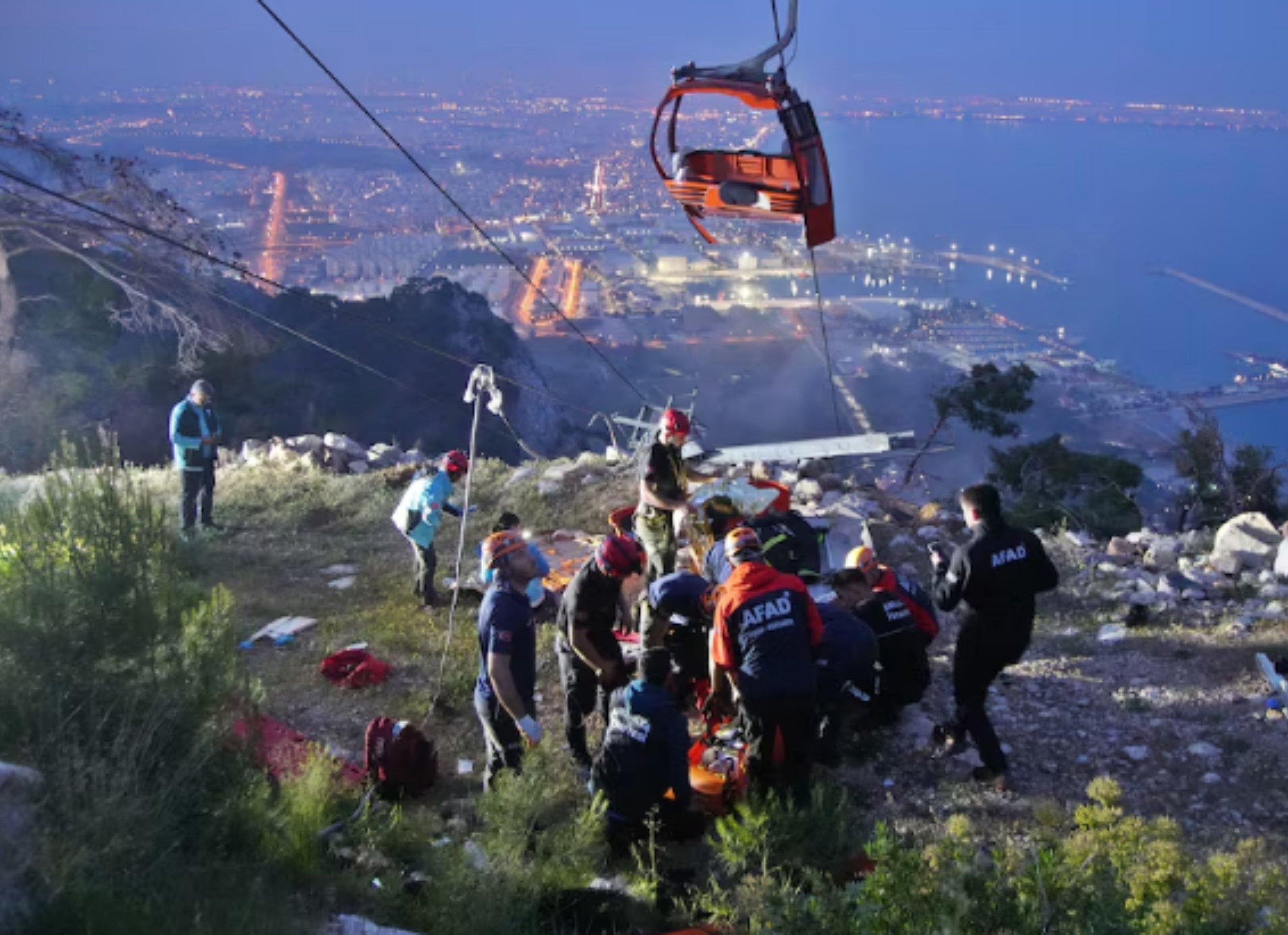 members of turkey s disaster management authority afad take part in a rescue operation after a cable car cabin collided with a broken pole in antalya turkey april 12 2024 ihlas news agency via photo reuters