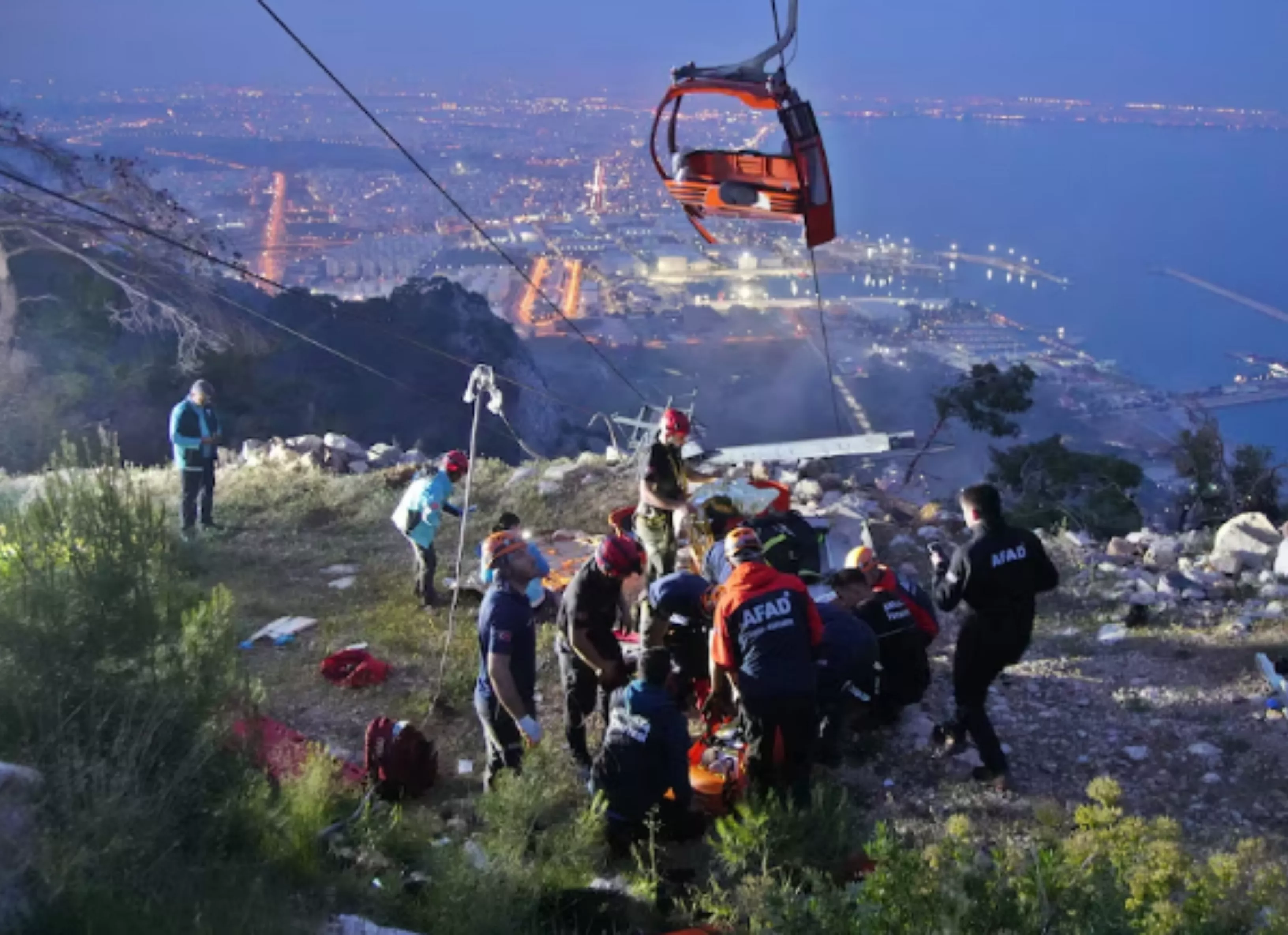 members of turkey s disaster management authority afad take part in a rescue operation after a cable car cabin collided with a broken pole in antalya turkey april 12 2024 ihlas news agency via photo reuters members of turkey s disaster management authority afad take part in a rescue operation after a cable car cabin collided with a broken pole in antalya turkey april 12 2024 ihlas news agency via photo reuters