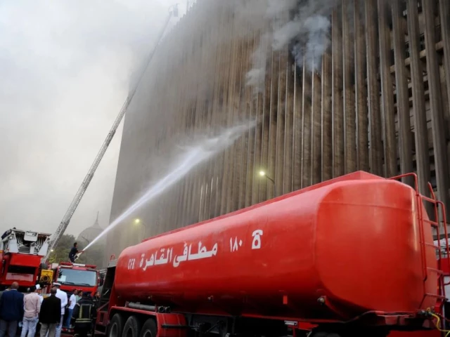 firefighters douse the flames after a fire broke out in the telephones landline exchanging station and ministry of communications building in cairo on july 7 photo afp firefighters douse the flames after a fire broke out in the telephones landline exchanging station and ministry of communications building in cairo on july 7 photo afp