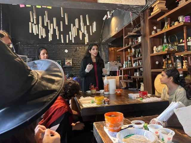 a cake decorating instructor demonstrates how to make cake toppers with fondant to a group of harry potter fans excited to make cakes inspired by the books in a workshop hosted at a themed restaurant in the federal capital photo zunairah qureshi express