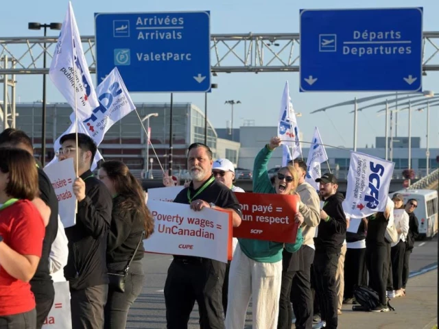 people hold placards as a strike begins after the union representing air canada s 10 000 flight attendants failed to reach an agreement with the airline at montreal pierre elliott trudeau international airport in dorval quebec canada august 16 2025 photo reuters