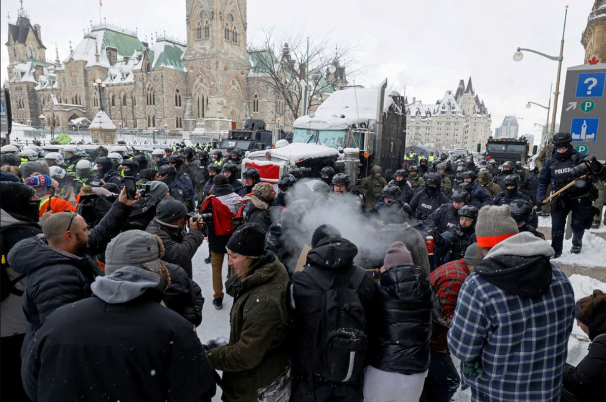 canadian police officers face off with protestors on parliament hill as they work to restore normality to the capital ontario canada february 19 2022 reuters blair gable