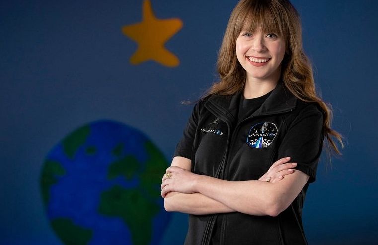 this undated photo courtesy of alsac received by afp on february 22 2021 shows st jude children s research hospital s physician assistant and cancer survivor hayley arceneaux posing for a photo when visiting a spacex facility in hawthorne california photo afp