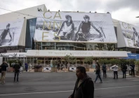 workers set up a giant canvas of the official poster featuring actors geena davis and susan sarandon from ridley scott s road movie thelma louise on the facade of the festival palace before the start of the 79th cannes film festival in cannes france may 10 2026 reuters marko djurica purchase licensing rights