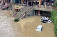 cars lie partially submerged in floodwaters after heavy rainfall in duyun guizhou province china may 19 2026 in this still image obtained from a social media video photo reuters