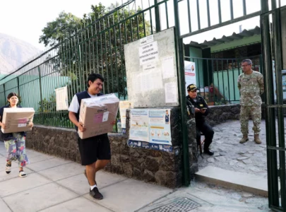 peruvians vote in crowded presidential race as runoff looms