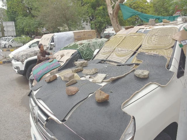 islamabad residents throw on whatever cover they can get their hands on to shield their vehicles from nature s wrath and save windscreens from bearing the brunt photo online islamabad residents throw on whatever cover they can get their hands on to shield their vehicles from nature s wrath and save windscreens from bearing the brunt photo online