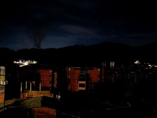 smoke rises near fort tiuna during a full blackout in caracas january 3 2026 source reuters smoke rises near fort tiuna during a full blackout in caracas january 3 2026 source reuters