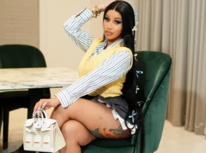 cardi b spotted with comically oversized chanel bag at disneyland paris with offset