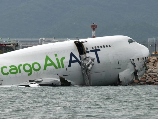 a cargo plane lies partially in the sea after veering off the runway during landing at hong kong international airport in hong kong china october 20 2025 photo reuters a cargo plane lies partially in the sea after veering off the runway during landing at hong kong international airport in hong kong china october 20 2025 photo reuters
