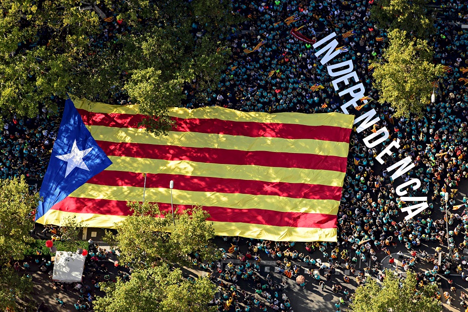 An aerial view shows people holding a giant 