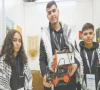 palestinian participants razan shawar jehad abudayyah and mustafa assi pose with their robot design at the world robot olympiad in singapore photo afp