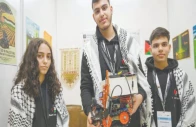 palestinian participants razan shawar jehad abudayyah and mustafa assi pose with their robot design at the world robot olympiad in singapore photo afp