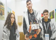palestinian participants razan shawar jehad abudayyah and mustafa assi pose with their robot design at the world robot olympiad in singapore photo afp palestinian participants razan shawar jehad abudayyah and mustafa assi pose with their robot design at the world robot olympiad in singapore photo afp