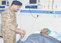 coas and cdf field marshal syed asim munir inquires after the health of a security personnel during his visit to combined military hospital in quetta photo ispr