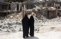 iranian women look at a building which was damaged in a us and israeli strike in march in tehran iran august 22 2026 reuters