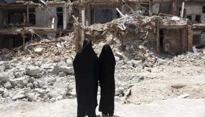 iranian women look at a building which was damaged in a us and israeli strike in march in tehran iran august 22 2026 reuters
