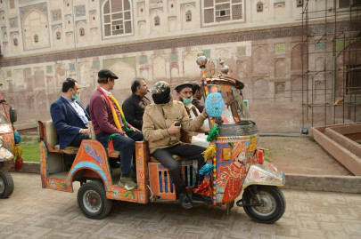 celebrities walk through the walled city