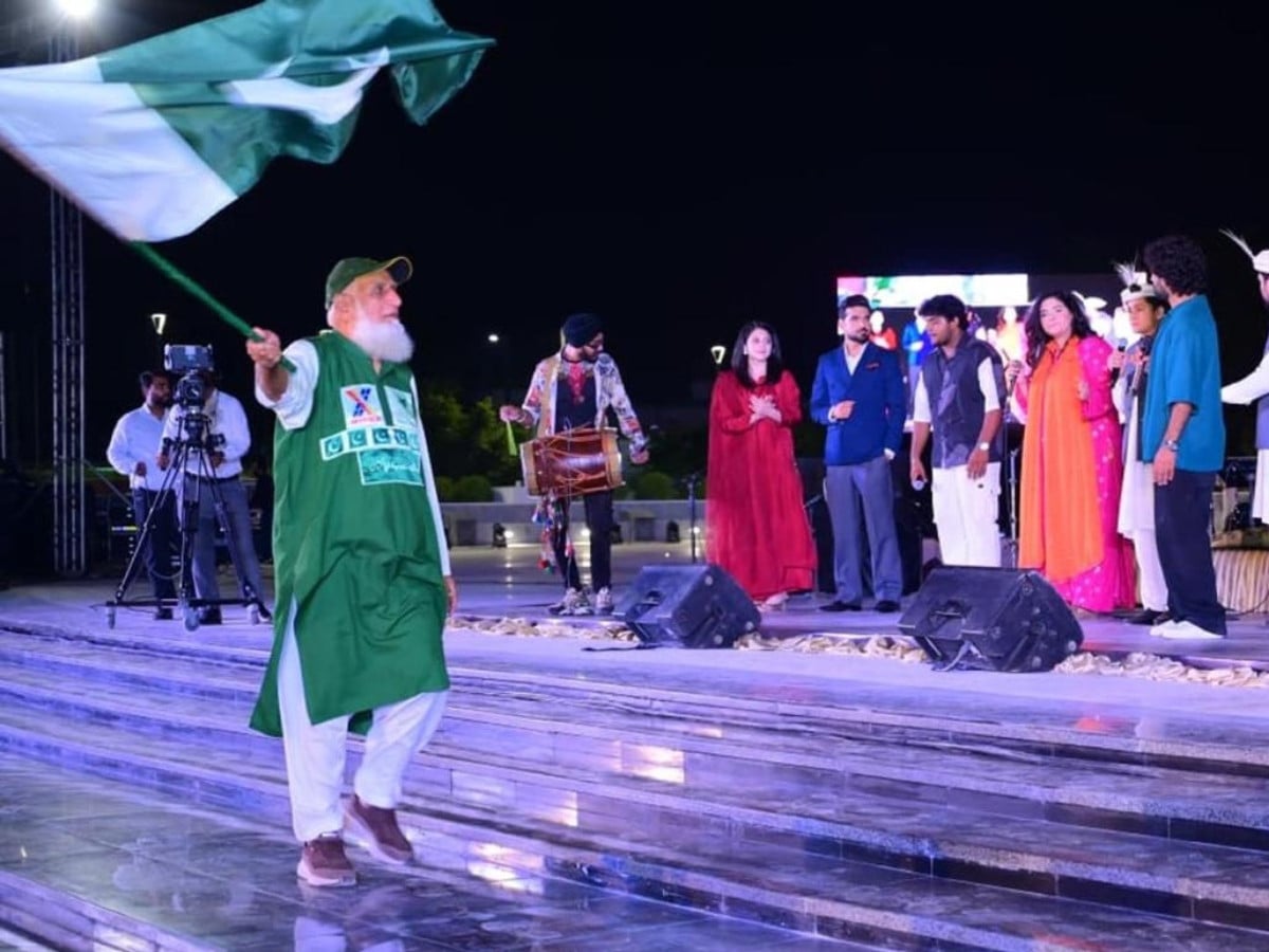Chacha Cricket waves the national flag during the opening ceremony of the Yadgar-e-Fatah (Monument of Victory) in Islamabad on Saturday. Photo: APP