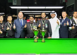pakistani cueists muhammad asif and asjad iqbal in the centre crowned ibsf world cup team snooker champions take a group photo with officials photo ibsf