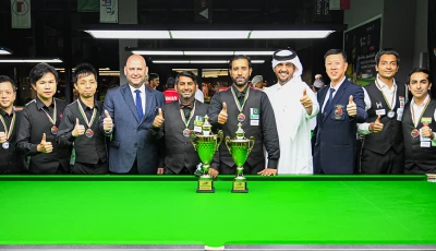 pakistani cueists muhammad asif and asjad iqbal in the centre crowned ibsf world cup team snooker champions take a group photo with officials photo ibsf