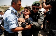 a palestinian youth is arrested by an israeli border police officer photo reuters