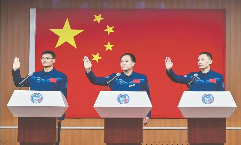 astronauts gui haichao left jing haipeng centre and zhu yangzhu wave during a press conference on monday at the jiuquan satellite launch centre located on the edge of the bataan jaran desert in china s north western gansu province photo afp astronauts gui haichao left jing haipeng centre and zhu yangzhu wave during a press conference on monday at the jiuquan satellite launch centre located on the edge of the bataan jaran desert in china s north western gansu province photo afp