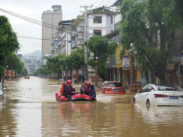 rescue workers evacuate flood affected residents with a boat in rongjiang county guizhou province china june 24 2025 photo reuters rescue workers evacuate flood affected residents with a boat in rongjiang county guizhou province china june 24 2025 photo reuters