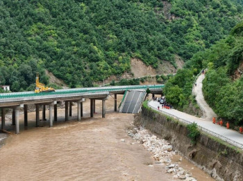 an aerial drone photo taken on july 20 2024 shows the site of a bridge collapse in zhashui county in shangluo city northwest china s shaanxi province photo xinhua