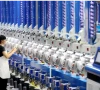 a worker checks automatic spool winders at a smart factory in xin an town deqing county zhejiang province china on june 15 2026 photo xinhua
