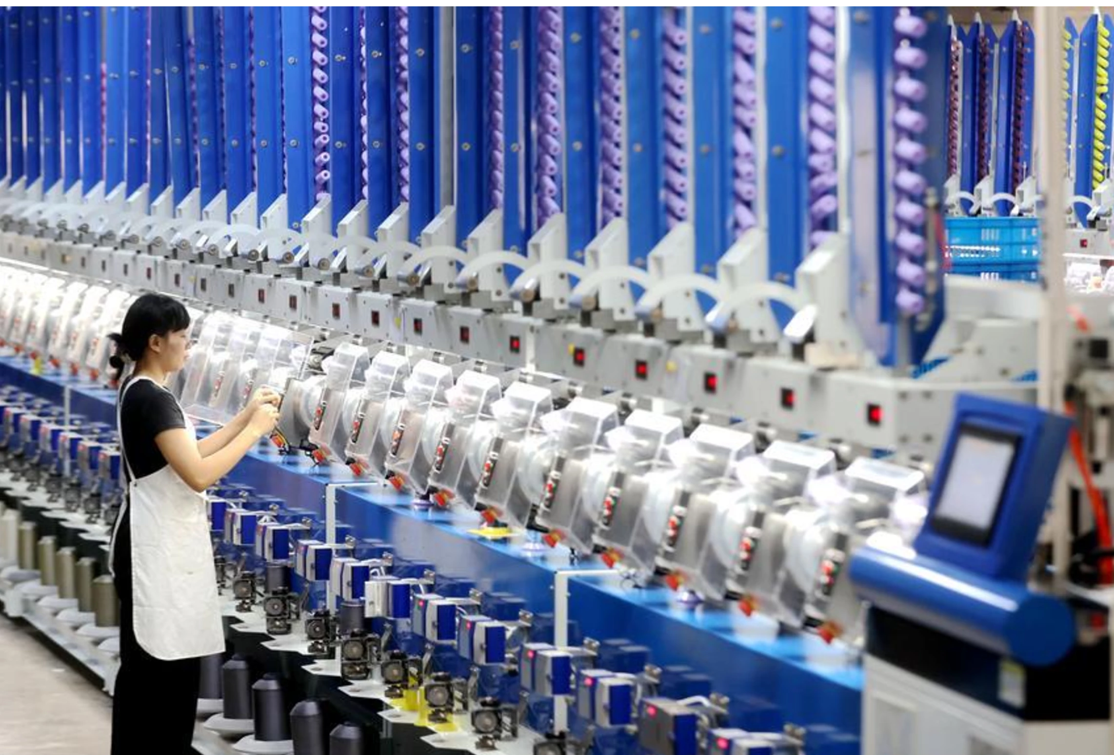 a worker checks automatic spool winders at a smart factory in xin an town deqing county zhejiang province china on june 15 2026 photo xinhua