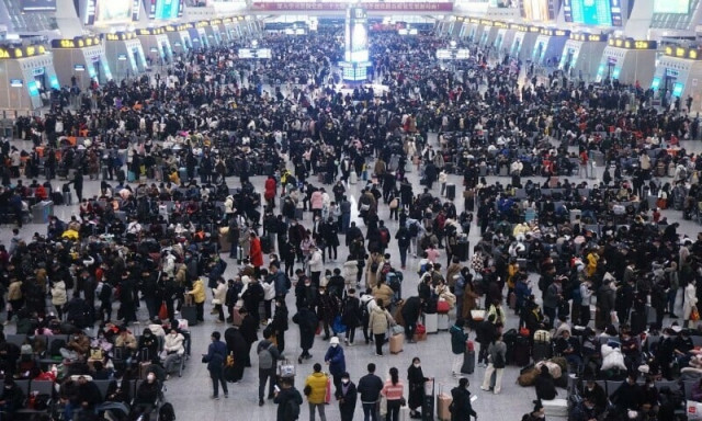 china plays down covid outbreak with holiday rush at full tilt photo reuters china plays down covid outbreak with holiday rush at full tilt photo reuters