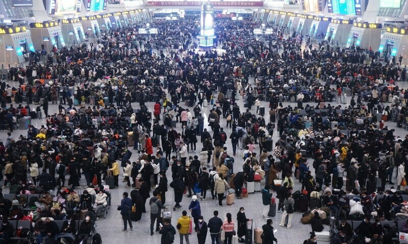 china plays down covid outbreak with holiday rush at full tilt photo reuters