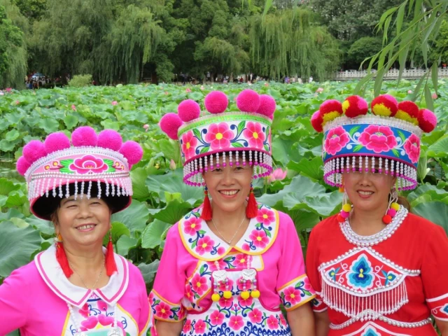three women in vibrant traditional attire smile at a lotus pond in china showcasing cultural beauty photo pexels three women in vibrant traditional attire smile at a lotus pond in china showcasing cultural beauty photo pexels
