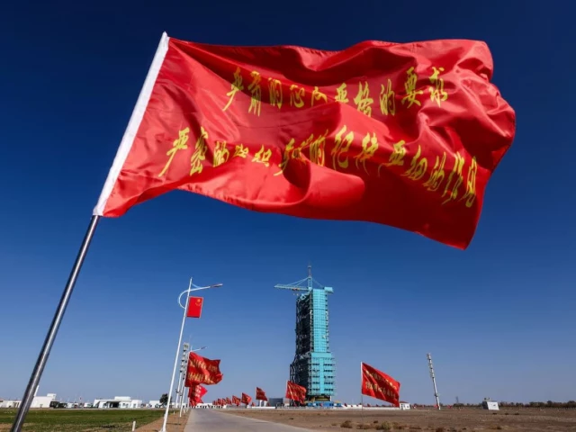 flags fly along the road near the launch pad for the long march 2f rocket ahead of the shenzhou 21 spaceflight mission to china s tiangong space station at the jiuquan satellite launch center near jiuquan gansu province china october 30 2025 photo reuters flags fly along the road near the launch pad for the long march 2f rocket ahead of the shenzhou 21 spaceflight mission to china s tiangong space station at the jiuquan satellite launch center near jiuquan gansu province china october 30 2025 photo reuters