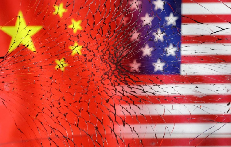 u s and chinese flags are seen through broken glass in this illustration taken january 30 2023 reuters dado ruvic illustration
