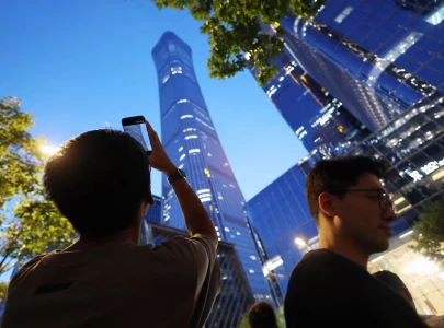 small aircraft crashes into beijing s tallest building eyewitnesses say