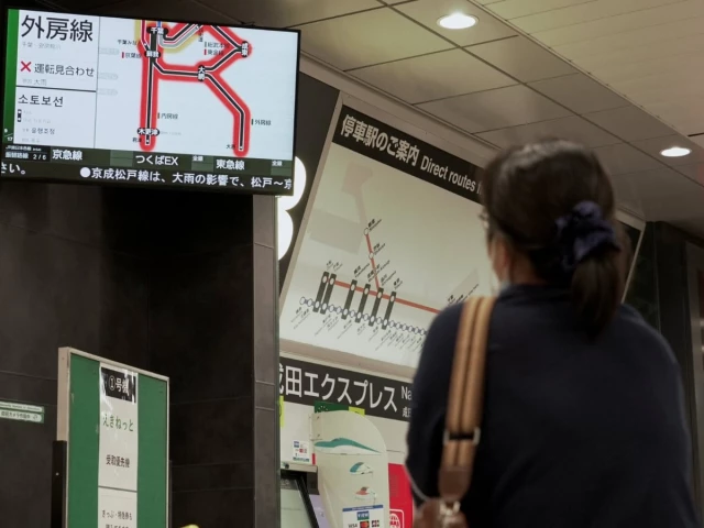 a passenger looks at a screen announcing suspended train services at a train station at narita international airport in narita chiba prefecture japan august 14 2026 photo reuters a passenger looks at a screen announcing suspended train services at a train station at narita international airport in narita chiba prefecture japan august 14 2026 photo reuters