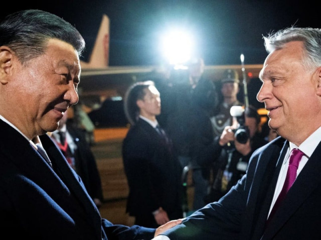hungarian prime minister viktor orban welcomes chinese president xi jinping at the ferenc liszt international airport in budapest hungary may 8 2024 photo reuters