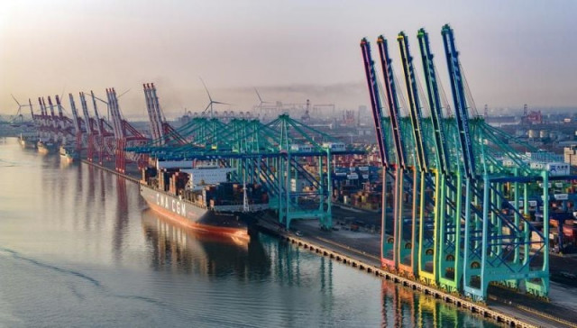 an aerial drone photo taken on feb 2 2024 shows a container vessel berthing at the smart zero carbon terminal of tianjin port in north china s tianjin photo xinhua