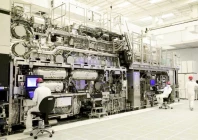 workers are seen in front of a high na euv lithography system at an intel facility in hillsboro oregon us in this handout image obtained by reuters on april 19 2024 intel corporation handout via reuters