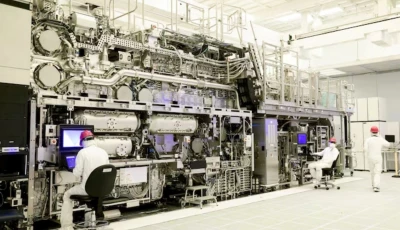 workers are seen in front of a high na euv lithography system at an intel facility in hillsboro oregon us in this handout image obtained by reuters on april 19 2024 intel corporation handout via reuters